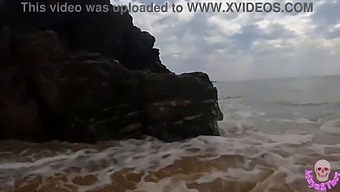 A Passionate Couple Engaging In Intimate Acts On A Seaside Beach